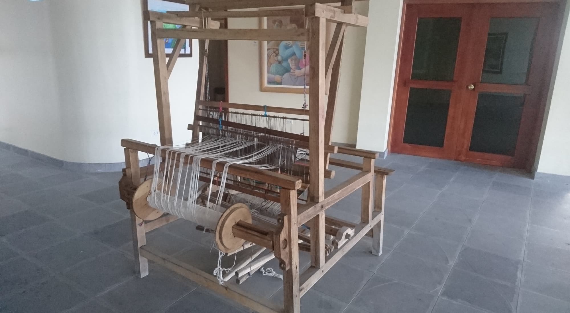 A traditional wooden handloom used by the Kichwa Otavalo people to weave the multicolored textiles their community is known for.